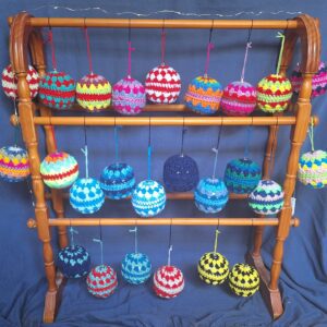 Photos of different coloured crocheted baubles